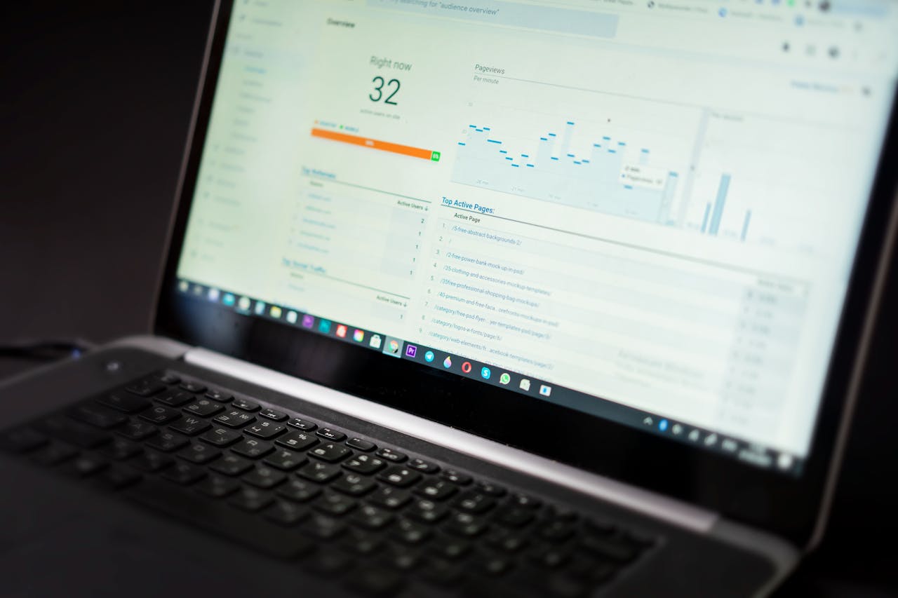 home-services-02 A laptop displaying an analytics dashboard with real-time data tracking and analysis tools.